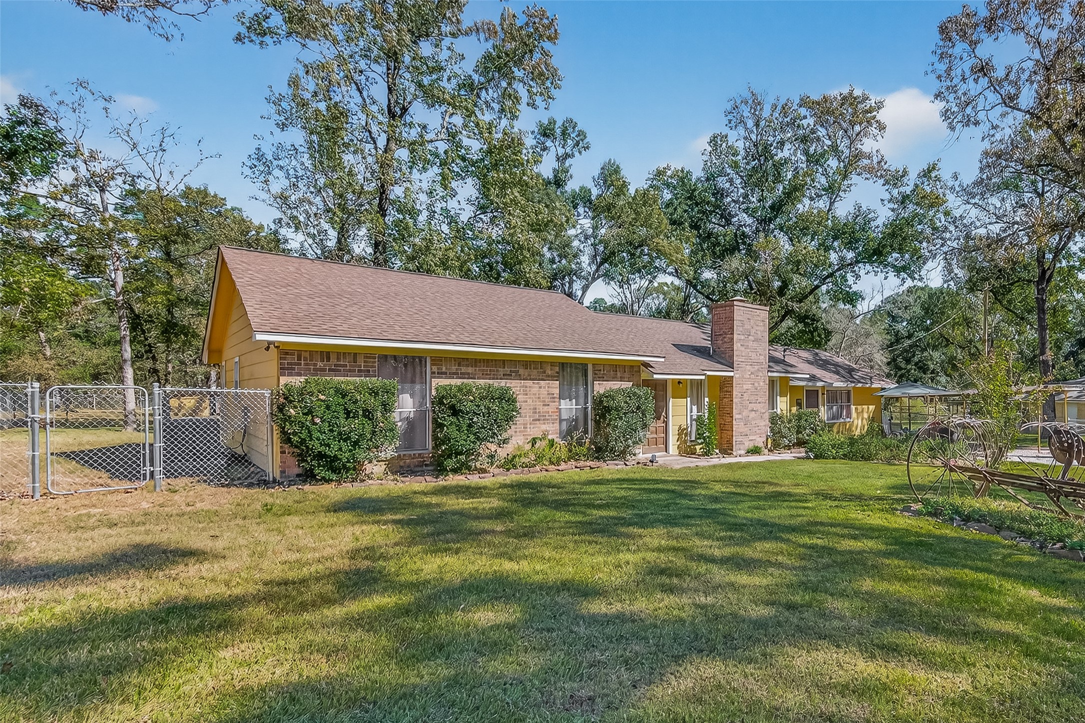 11535 Willis Waukegan Road Conroe, TX 77303 - Photo 3 of 47 a view of a house with a yard