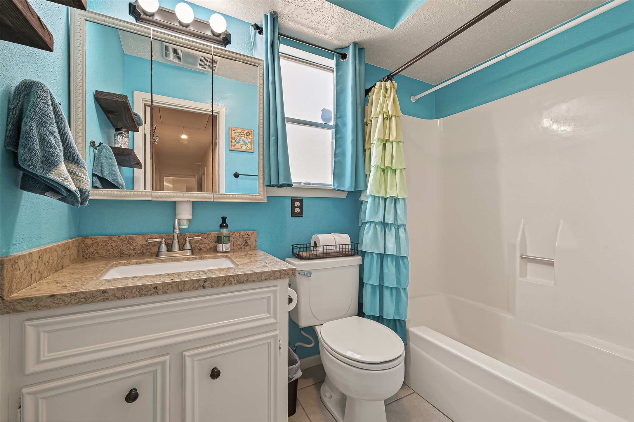 11535 Willis Waukegan Road Conroe, TX 77303 - Photo 32 of 47 a bathroom with a sink a toilet and a mirror