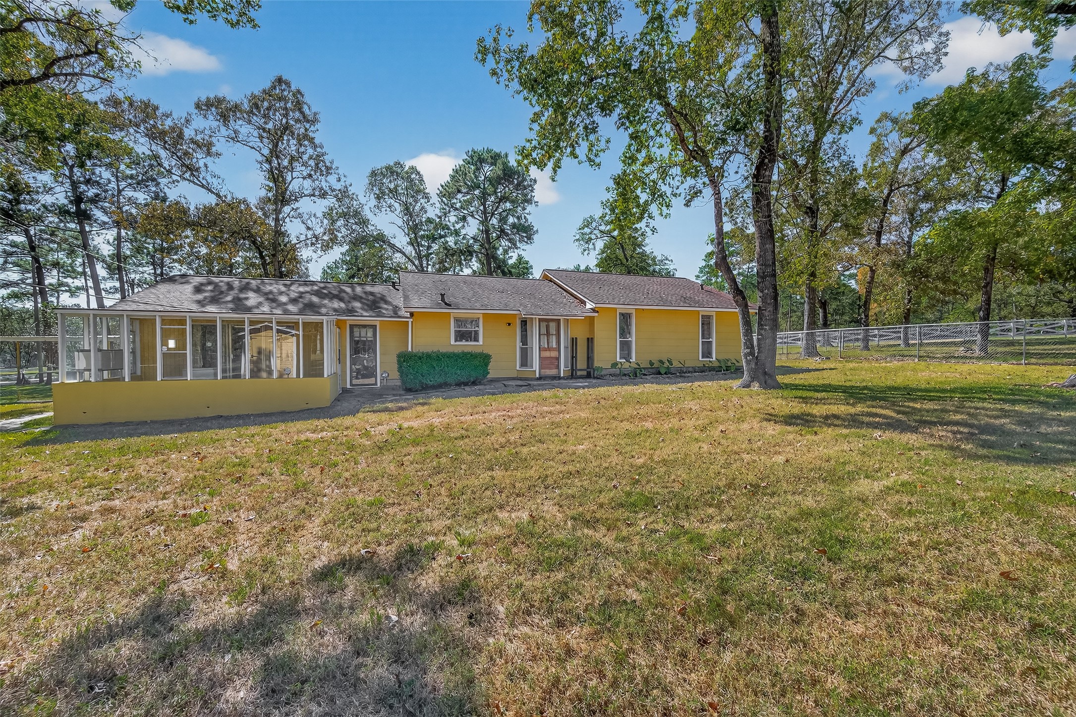 11535 Willis Waukegan Road Conroe, TX 77303 - Photo 42 of 47 a view of a house with a yard