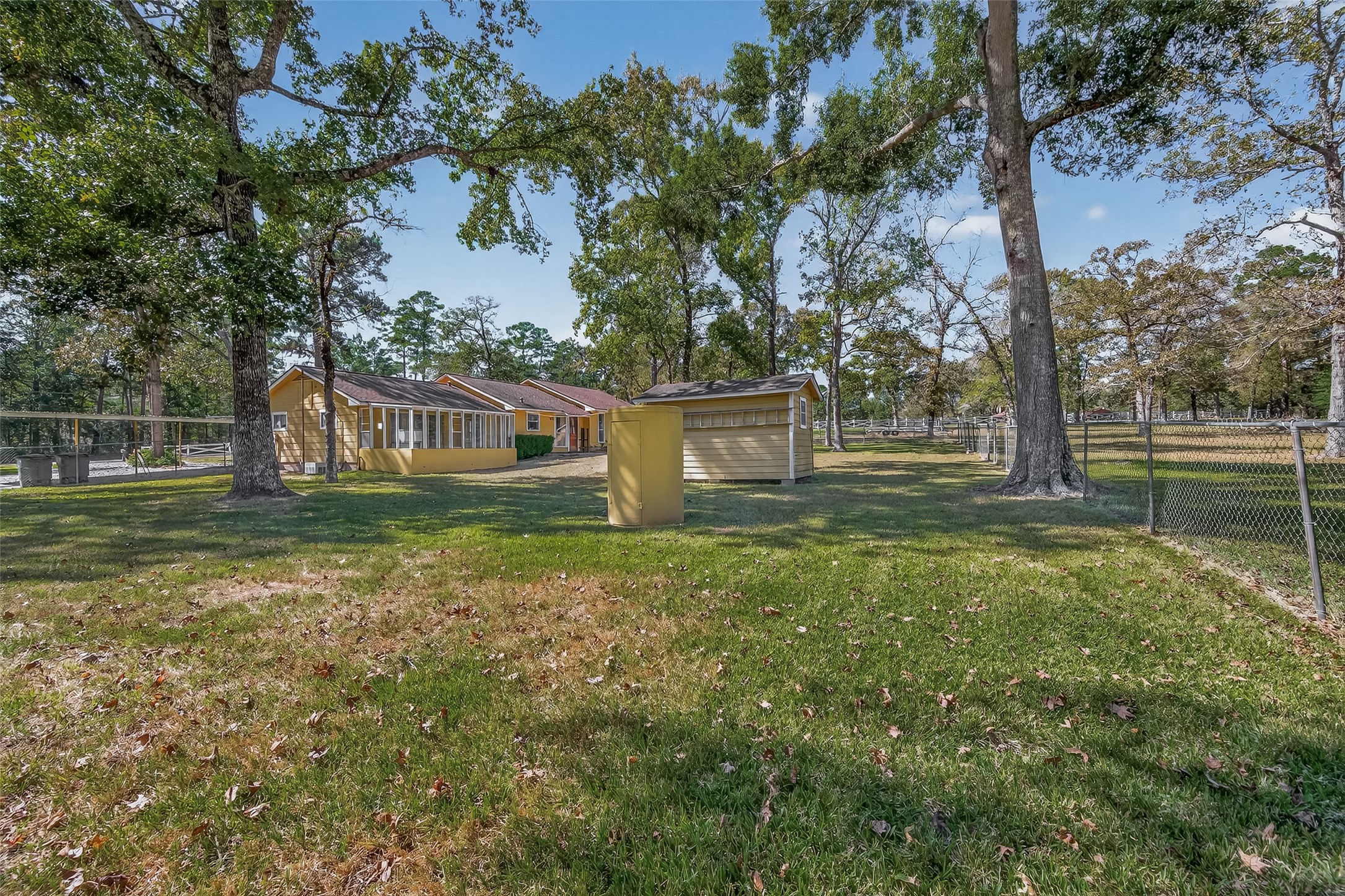 11535 Willis Waukegan Road Conroe, TX 77303 - Photo 44 of 47 a view of a house with a yard