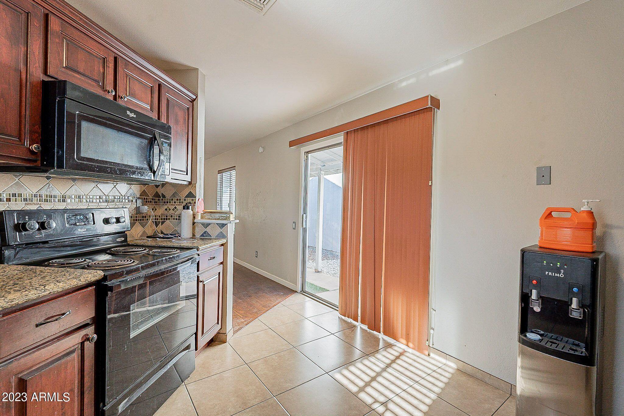 4422 East Vineyard Road Phoenix, AZ 85042 - Photo 7 of 25 Kitchen to outside