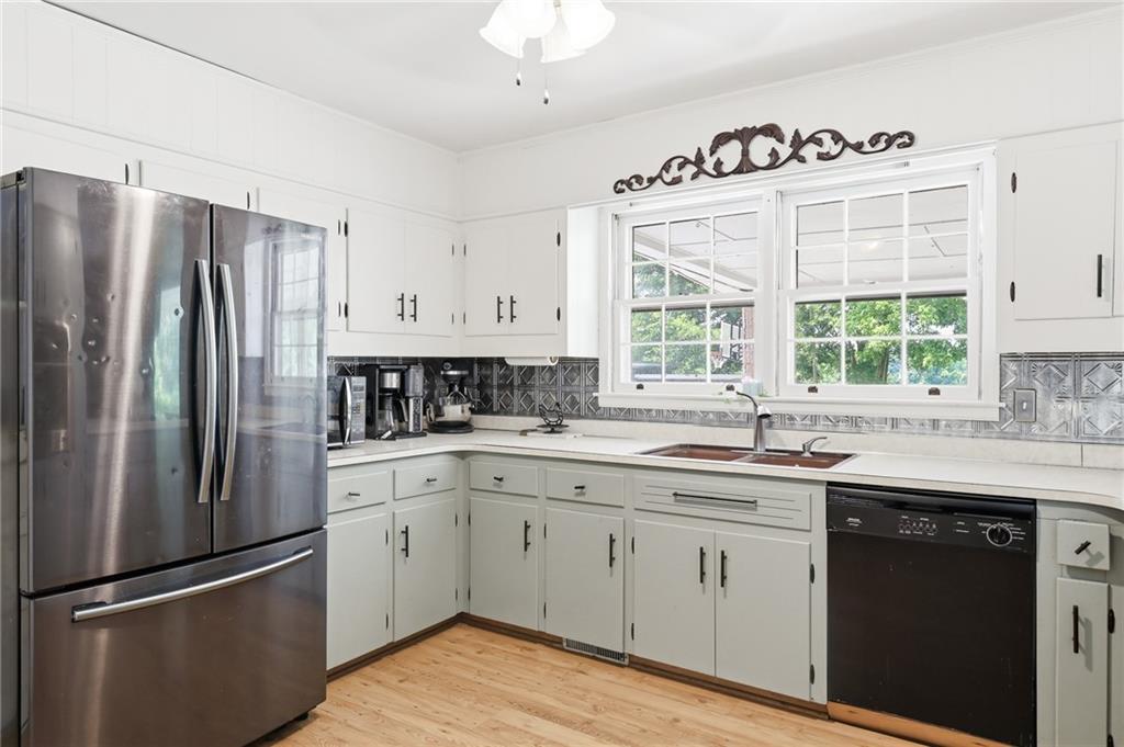 570 Wildcat Bridge Road Royston, GA 30662 - Photo 11 of 29 a kitchen with a refrigerator sink and cabinets