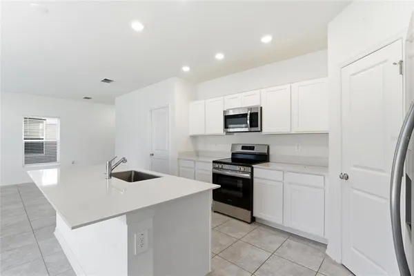 a view of a room with storage and utility room