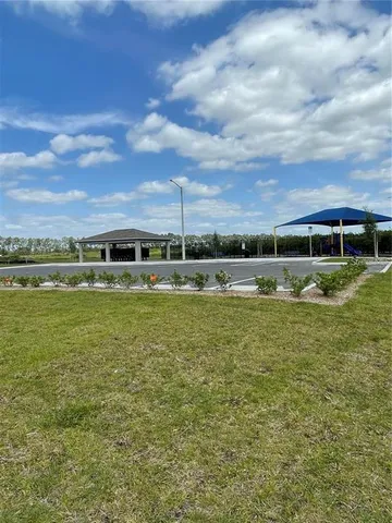 a view of a lake with houses in the background