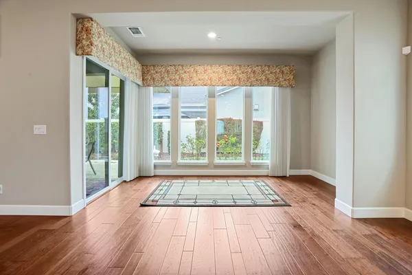 an empty room with closet and a bathroom