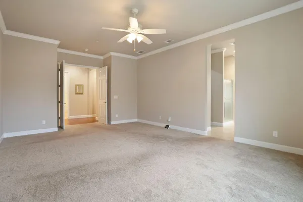 a kitchen with a refrigerator and cabinets