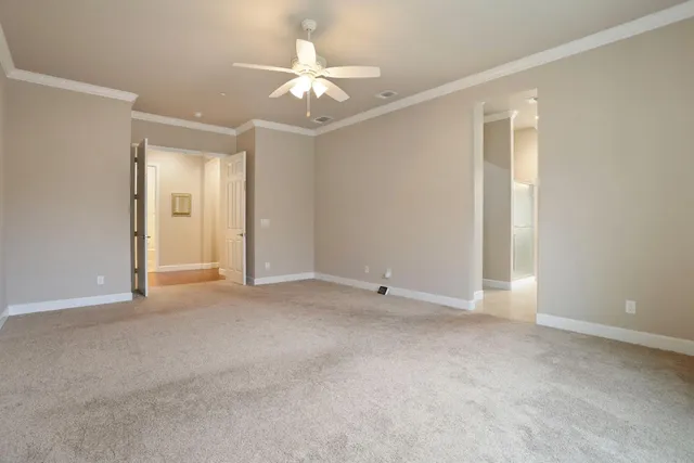 a kitchen with a refrigerator and cabinets