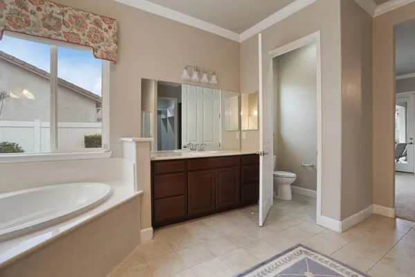 a view of a swimming pool with a table and chairs