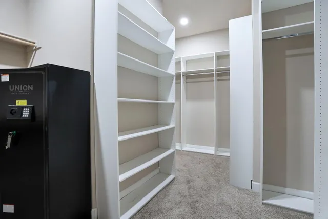 a living room with furniture a table and a large window