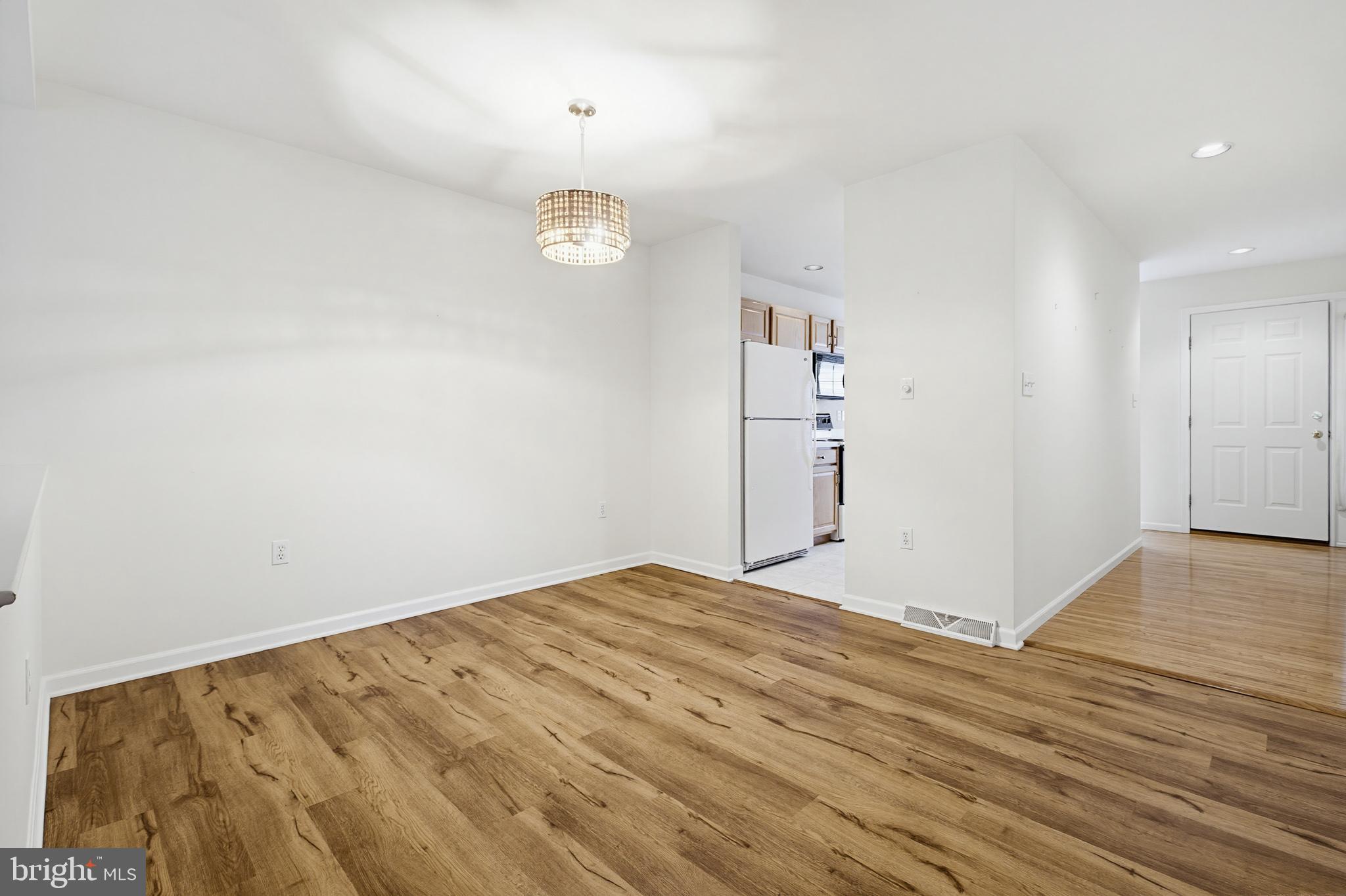 1037 Kent Garden Lititz, PA 17543 - Photo 13 of 31 a view of empty room with wooden floor and window