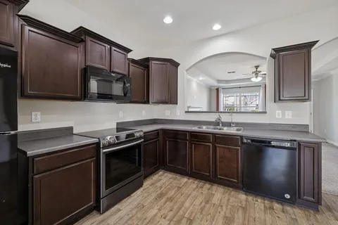 a view of an entryway with wooden floor
