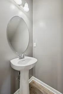 a view of a kitchen with a refrigerator and a window