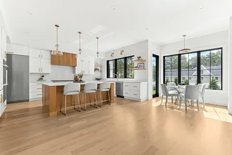 a kitchen with stainless steel appliances granite countertop a stove and a refrigerator