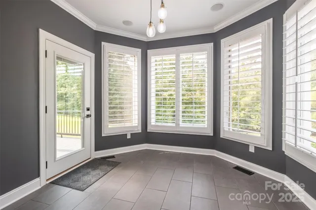 a bathroom with a granite countertop sink toilet mirror and shower