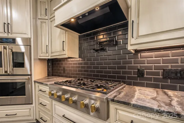 a bathroom with a granite countertop sink a mirror a vanity and a shower