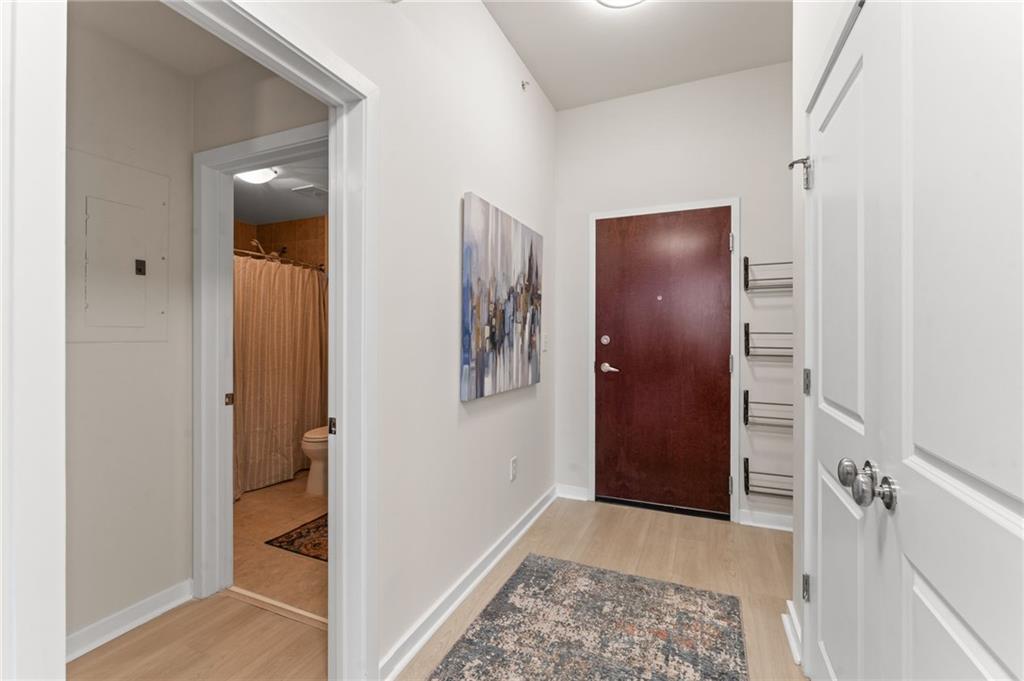 3300 Windy Ridge Parkway Southeast, Unit 809 Atlanta, GA 30339 - Photo 2 of 30 walk in closet with wooden floor