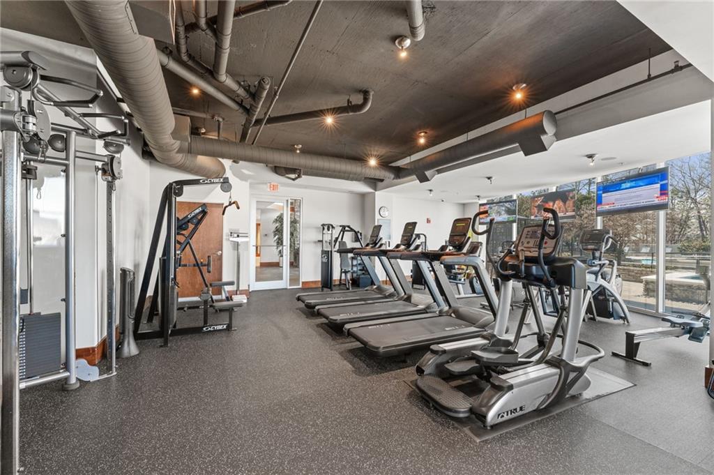 3300 Windy Ridge Parkway Southeast, Unit 809 Atlanta, GA 30339 - Photo 23 of 30 a view of a room with gym equipment