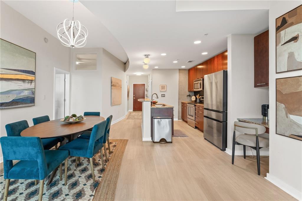 3300 Windy Ridge Parkway Southeast, Unit 809 Atlanta, GA 30339 - Photo 6 of 30 a large kitchen with a table and chairs