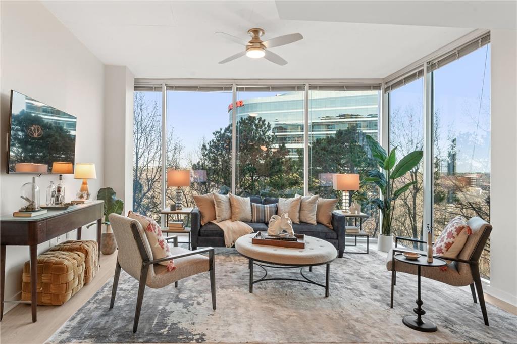 3300 Windy Ridge Parkway Southeast, Unit 809 Atlanta, GA 30339 - Photo 8 of 30 a living room with furniture and a large window