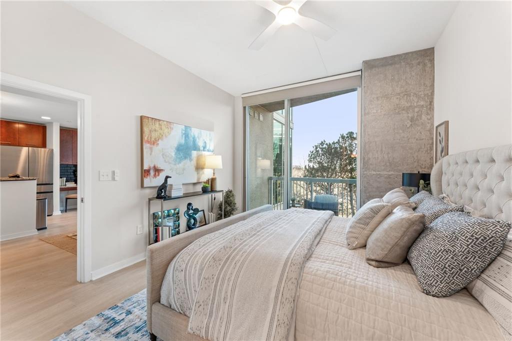 3300 Windy Ridge Parkway Southeast, Unit 809 Atlanta, GA 30339 - Photo 10 of 30 a bedroom with a large bed and a window