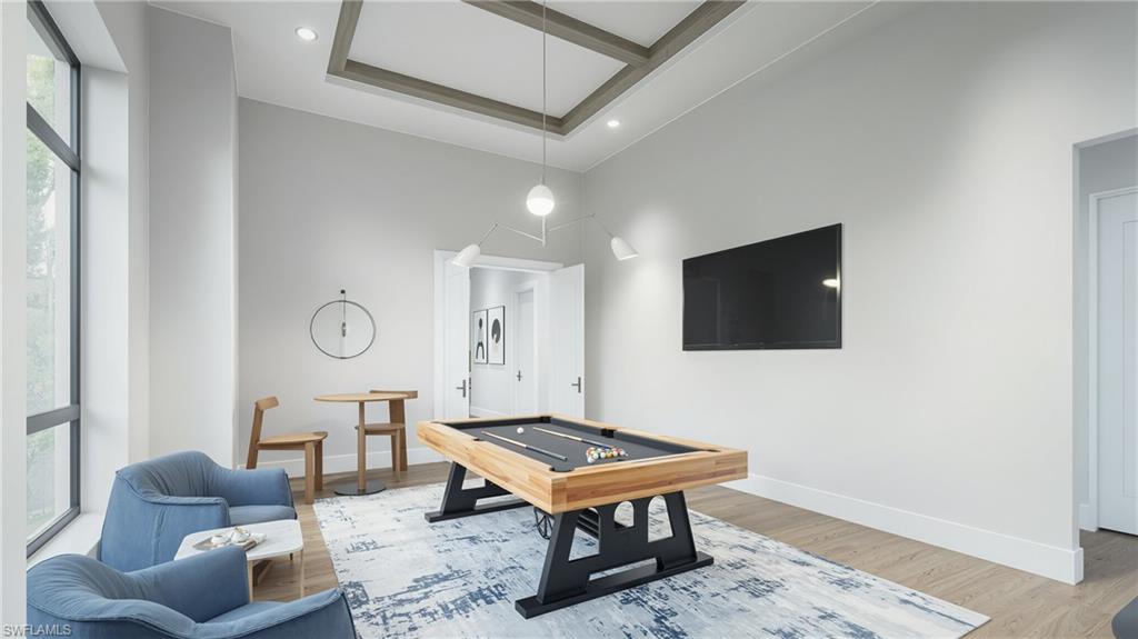 444 Orchid Drive Naples, FL 34102 - Photo 12 of 24 a living room with furniture and a rug