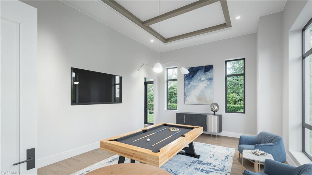 444 Orchid Drive Naples, FL 34102 - Photo 13 of 24 a living room with furniture and a window