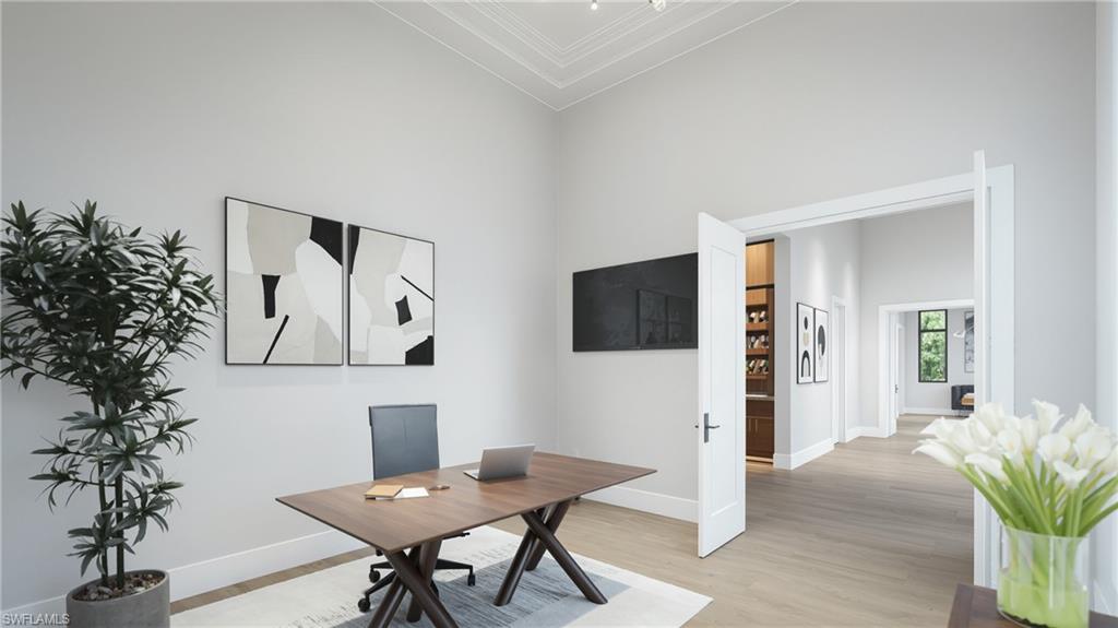 444 Orchid Drive Naples, FL 34102 - Photo 14 of 24 a living room with furniture and a potted plant