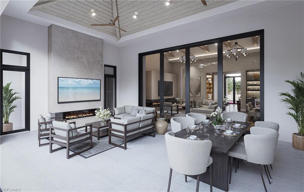 444 Orchid Drive Naples, FL 34102 - Photo 17 of 24 a living room with furniture and large windows