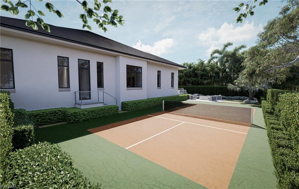 444 Orchid Drive Naples, FL 34102 - Photo 20 of 24 a front view of house with yard and green space