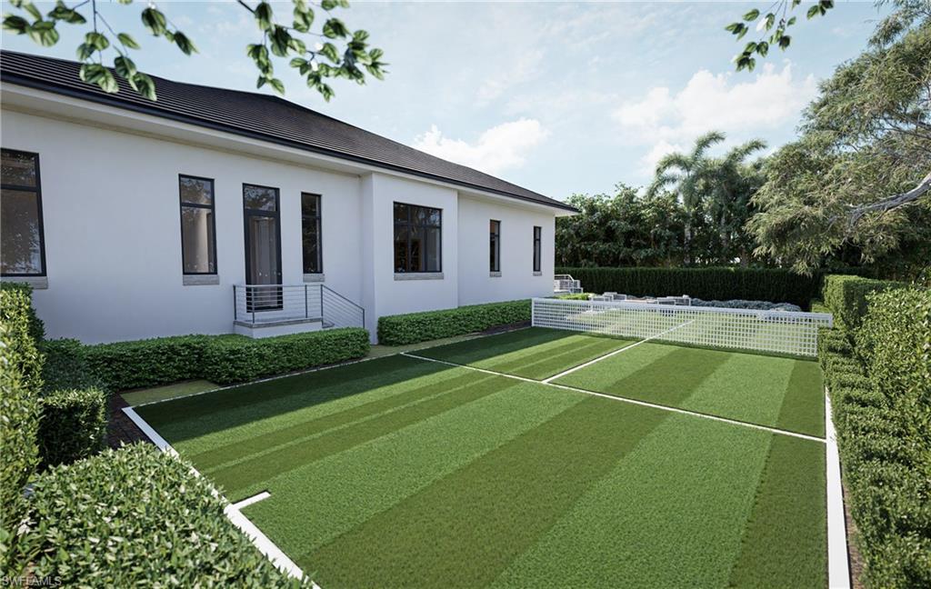 444 Orchid Drive Naples, FL 34102 - Photo 22 of 24 a view of a house with a backyard