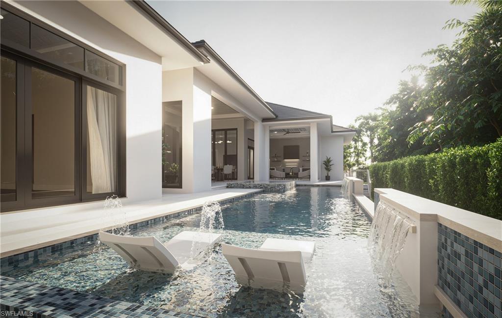 444 Orchid Drive Naples, FL 34102 - Photo 23 of 24 a view of a swimming pool with a patio