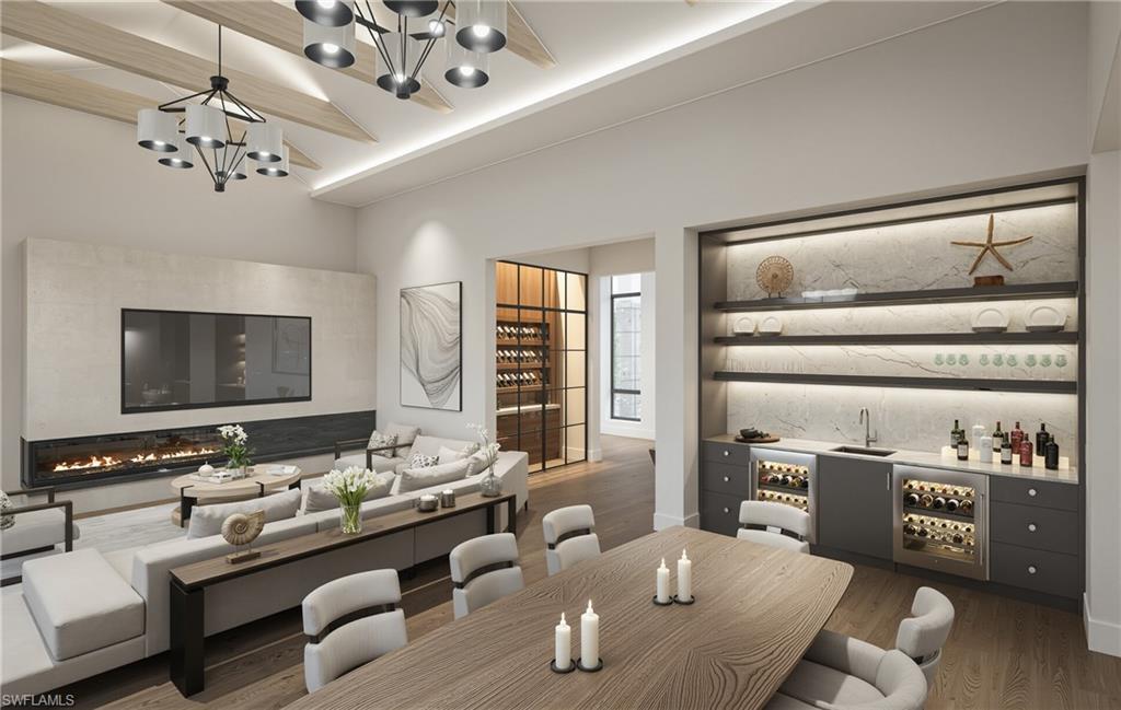 444 Orchid Drive Naples, FL 34102 - Photo 4 of 24 a living room with furniture and a chandelier