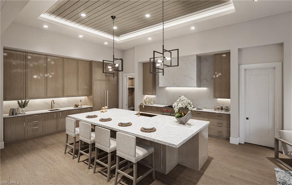 444 Orchid Drive Naples, FL 34102 - Photo 5 of 24 a kitchen that has a table and chairs in it