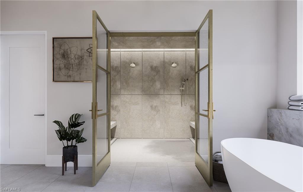 444 Orchid Drive Naples, FL 34102 - Photo 9 of 24 a bathroom with a shower and a toilet