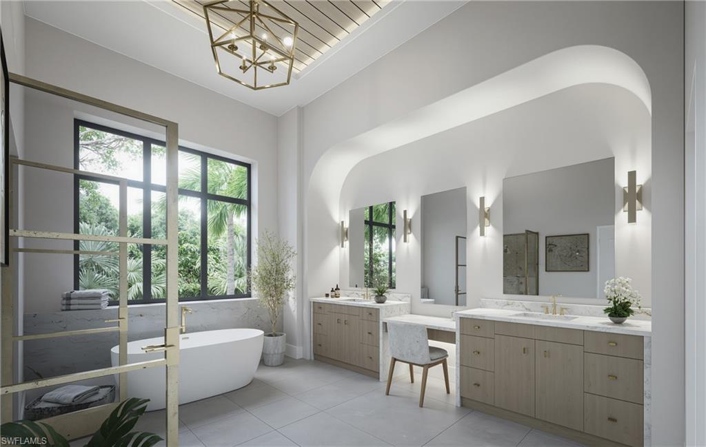 444 Orchid Drive Naples, FL 34102 - Photo 10 of 24 a bathroom with a double vanity sink a large mirror a bathtub and next to a window