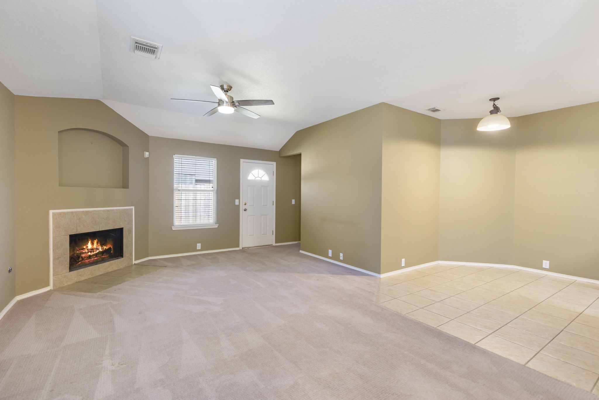4815 Rustic Field Lane Katy, TX 77449 - Photo 13 of 47 a view of a livingroom with a fireplace and a ceiling fan