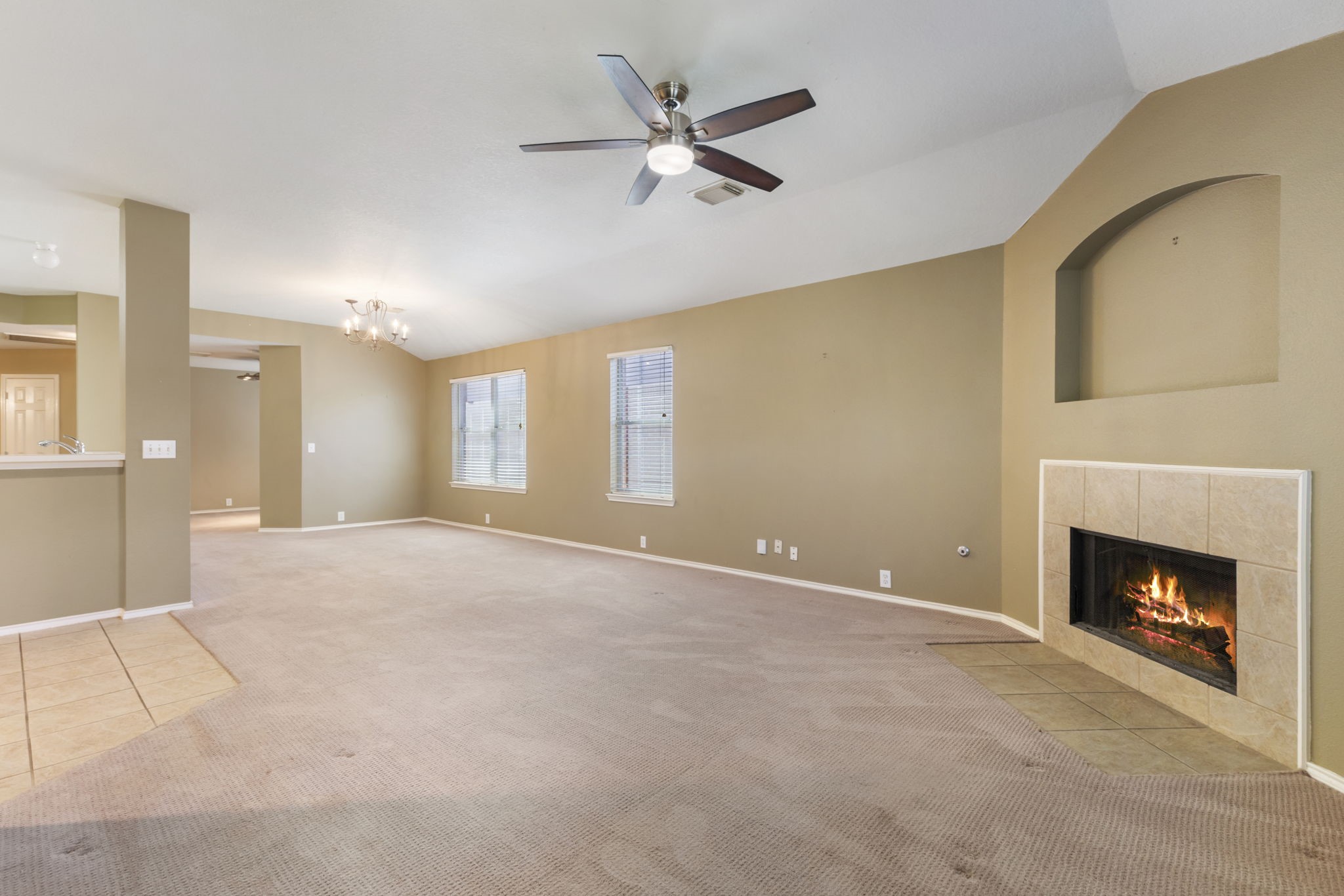 4815 Rustic Field Lane Katy, TX 77449 - Photo 15 of 47 a view of an empty room with a fireplace and a window
