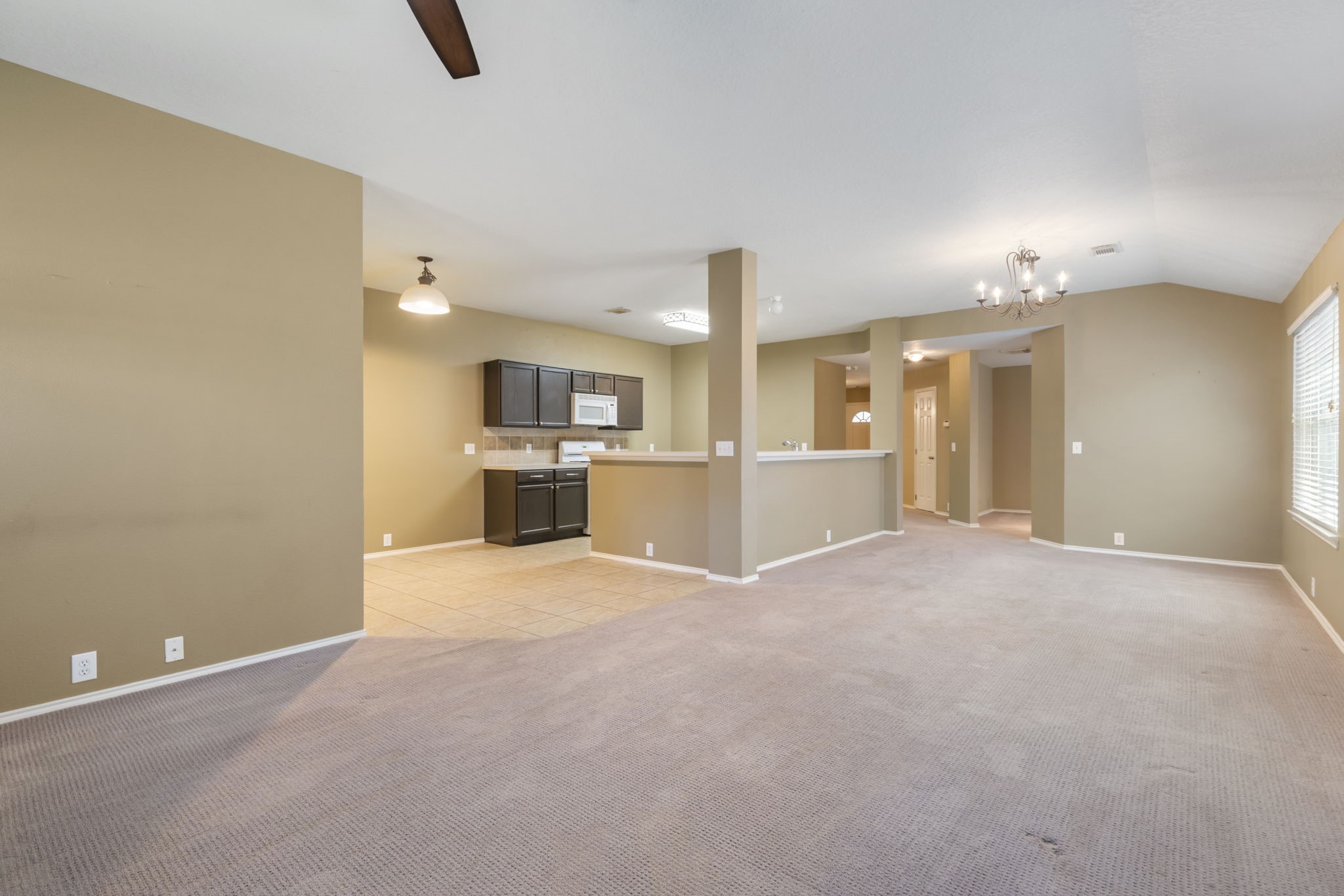 4815 Rustic Field Lane Katy, TX 77449 - Photo 16 of 47 a view of a kitchen with a sink and a refrigerator
