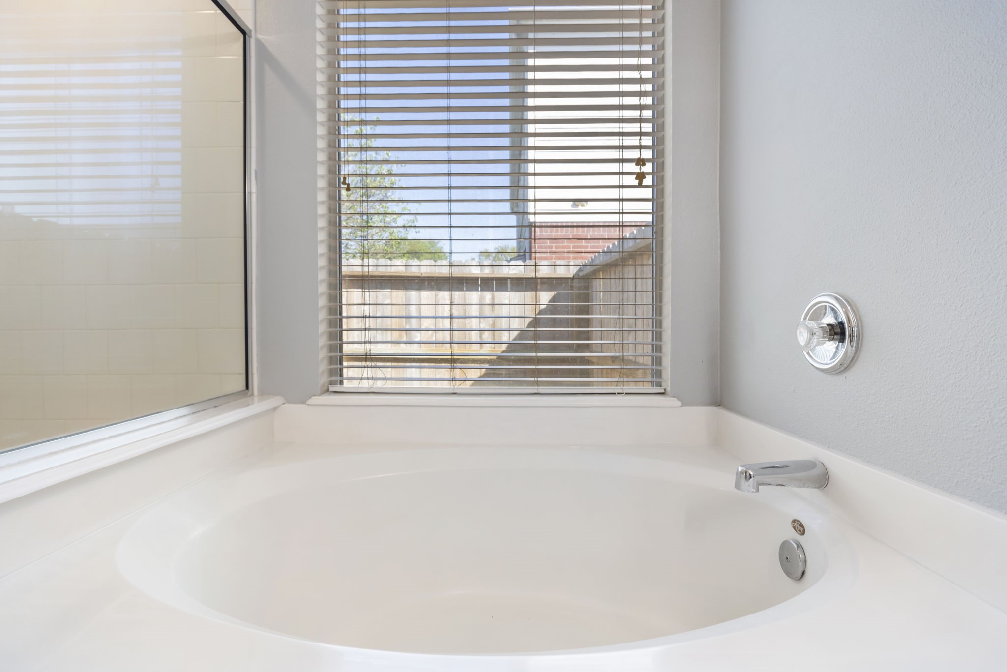 4815 Rustic Field Lane Katy, TX 77449 - Photo 27 of 47 a white tub sitting in a bathroom next to a window