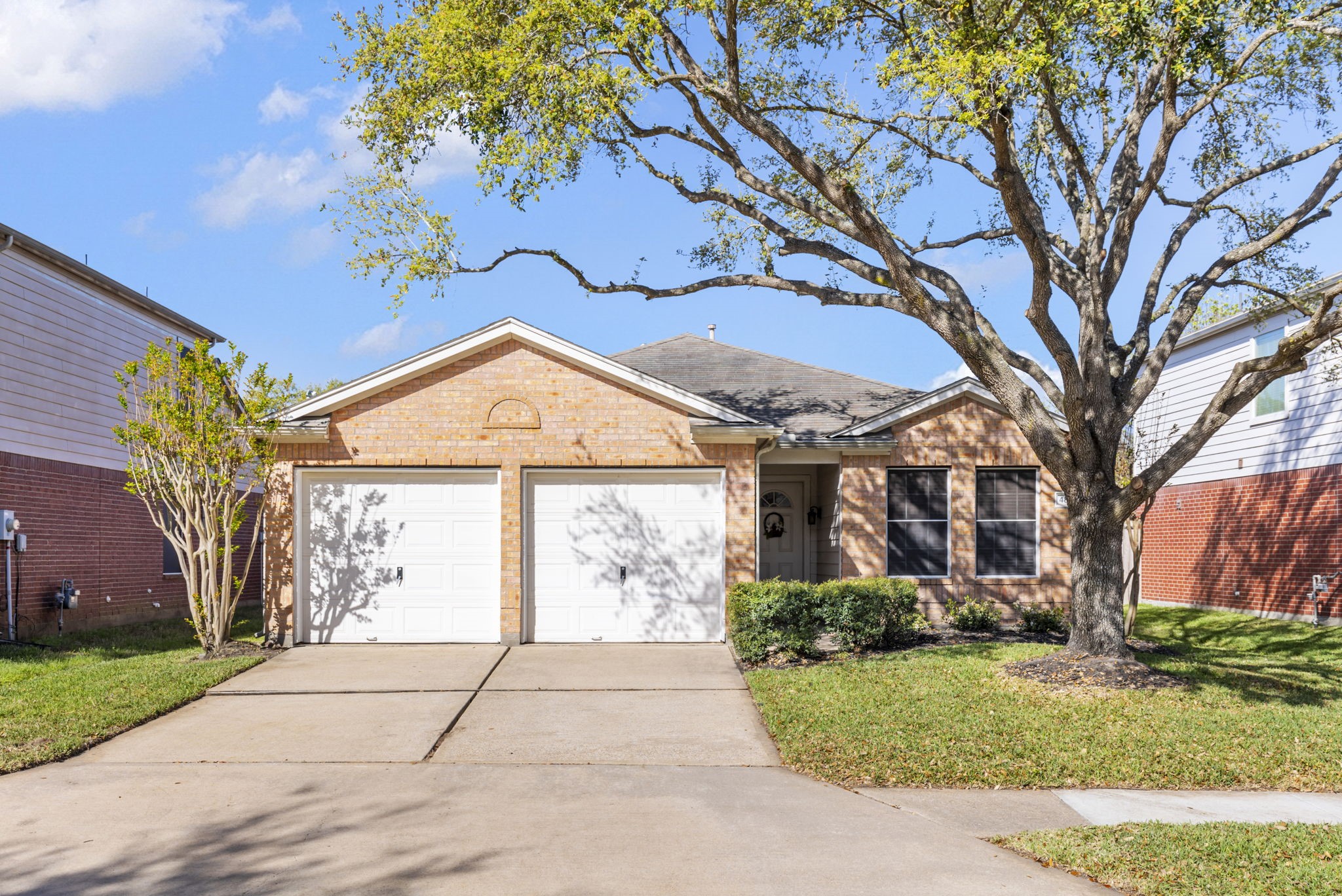 4815 Rustic Field Lane Katy, TX 77449 - Photo 3 of 47 a front view of a house with garden