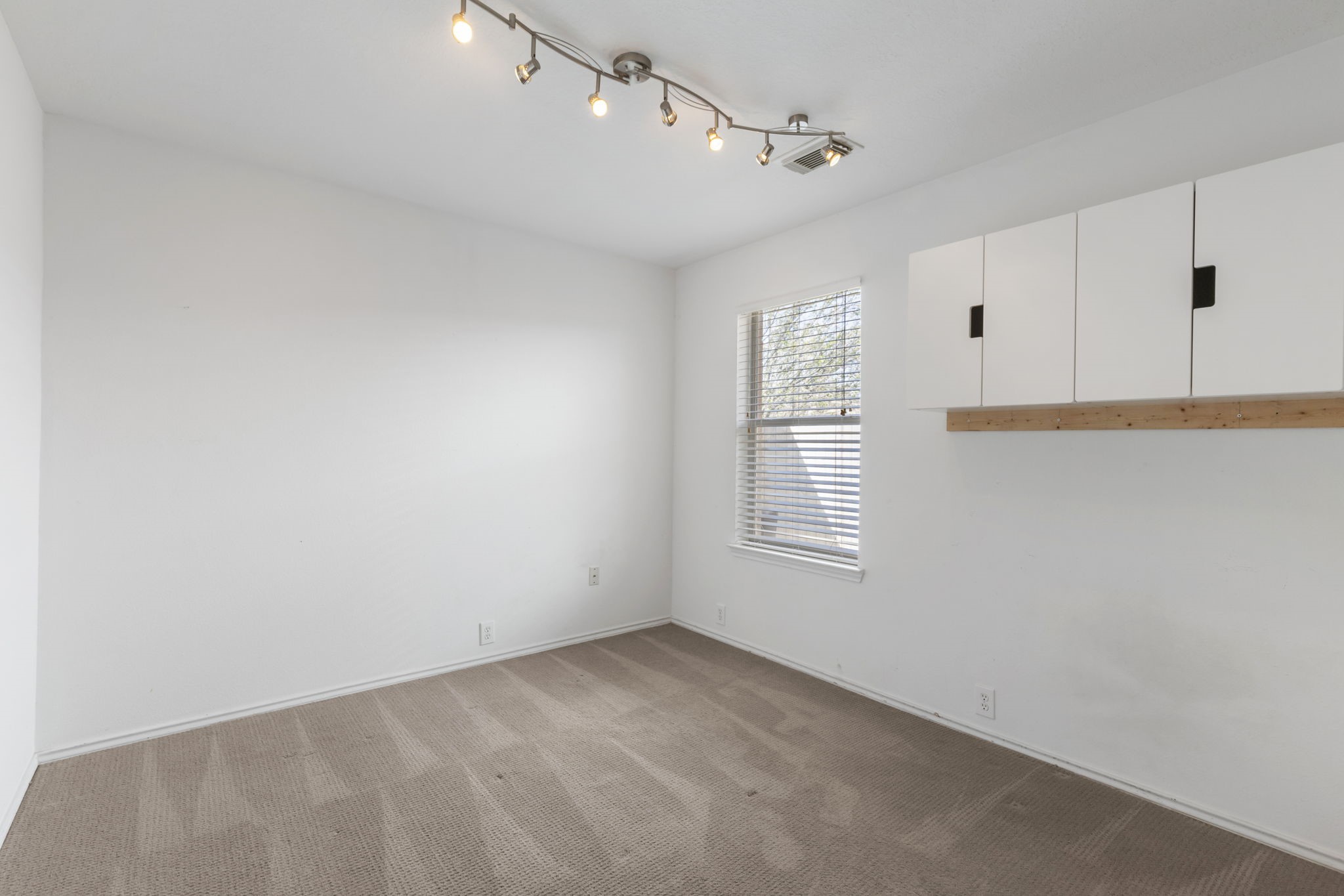 4815 Rustic Field Lane Katy, TX 77449 - Photo 33 of 47 a view of an empty room with a window