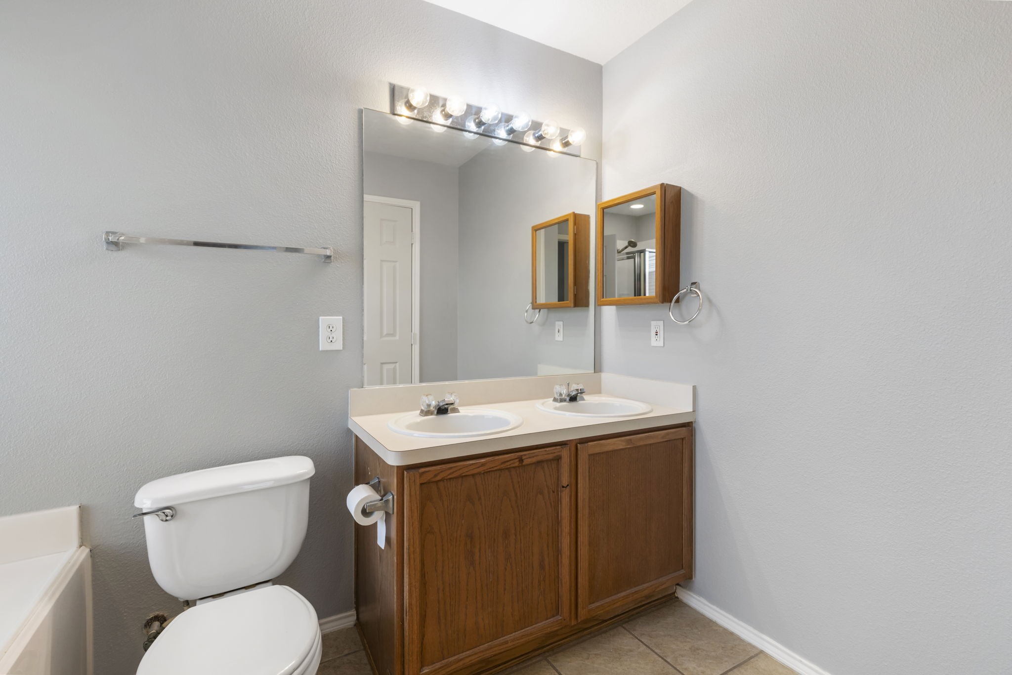 4815 Rustic Field Lane Katy, TX 77449 - Photo 35 of 47 a bathroom with a toilet sink and mirror