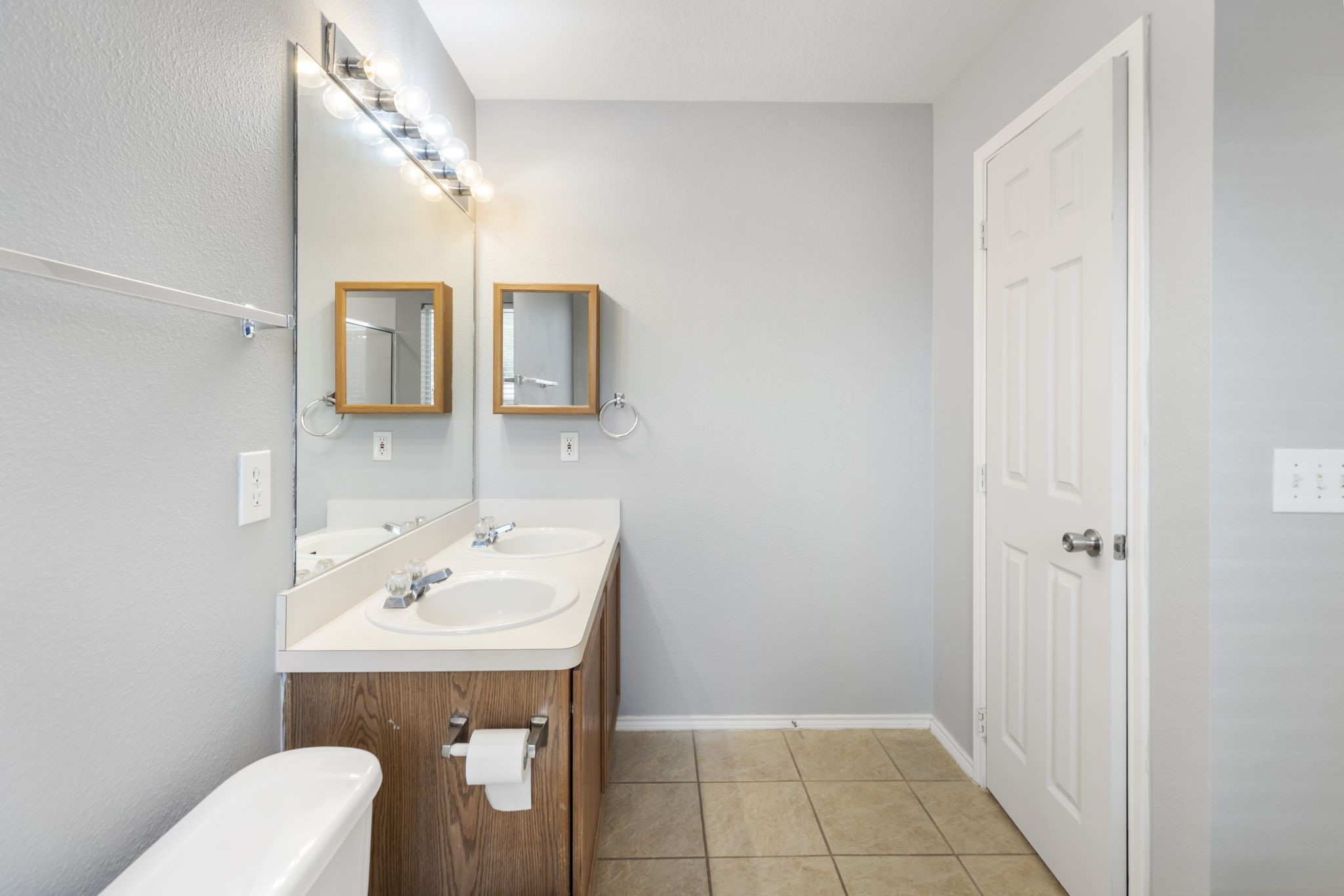 4815 Rustic Field Lane Katy, TX 77449 - Photo 37 of 47 a bathroom with a sink a toilet and mirror