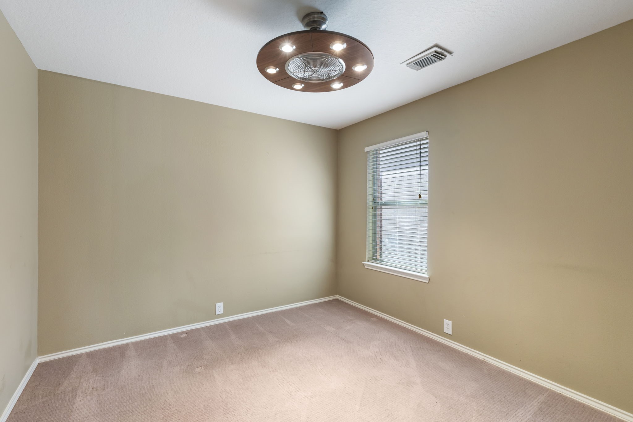 4815 Rustic Field Lane Katy, TX 77449 - Photo 38 of 47 an empty room with a window and closet