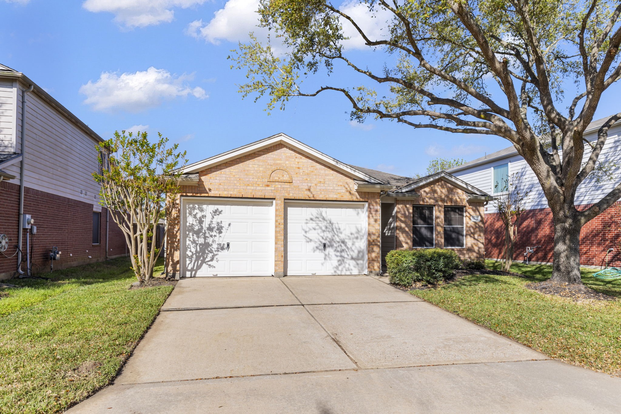 4815 Rustic Field Lane Katy, TX 77449 - Photo 4 of 47 a front view of a house with garden