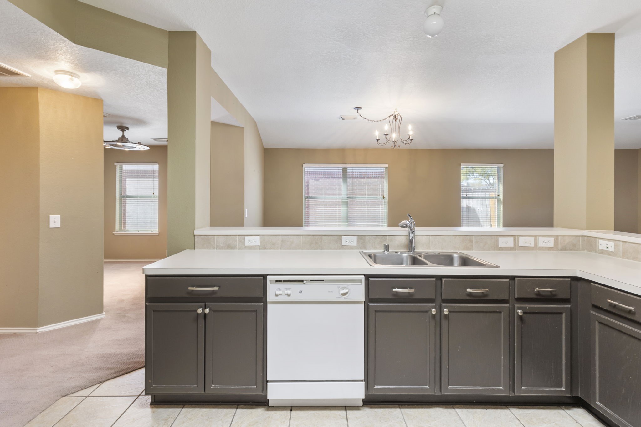 4815 Rustic Field Lane Katy, TX 77449 - Photo 9 of 47 a kitchen with a sink and a cabinets