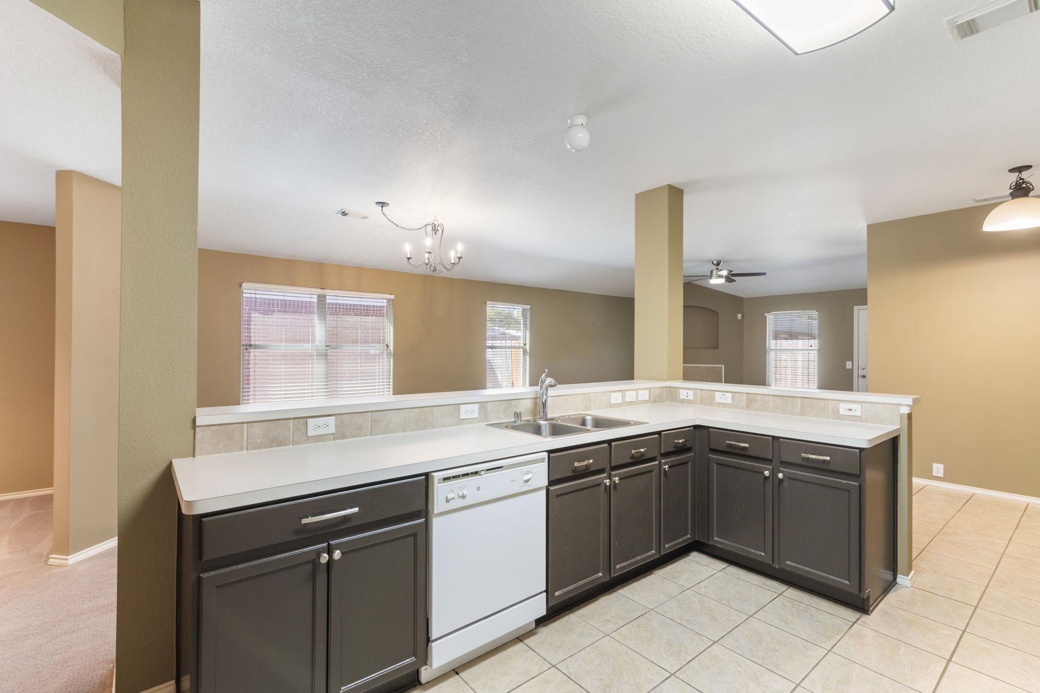 4815 Rustic Field Lane Katy, TX 77449 - Photo 10 of 47 a kitchen with a sink and cabinets