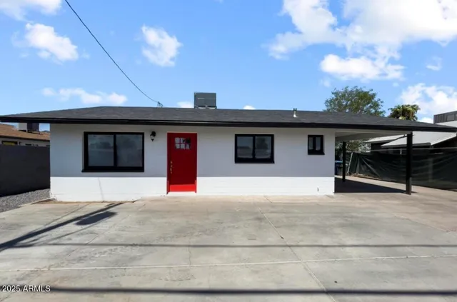 a house with trees in the background