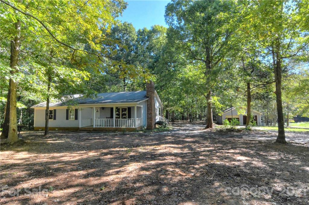 3621 Austin Road Monroe, NC 28112 - Photo 2 of 28 a backyard of a house with yard and outdoor seating