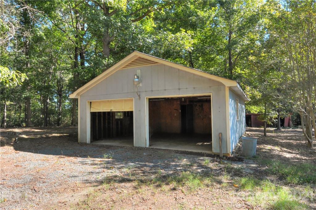 3621 Austin Road Monroe, NC 28112 - Photo 11 of 28 a view of a house with a yard and garage